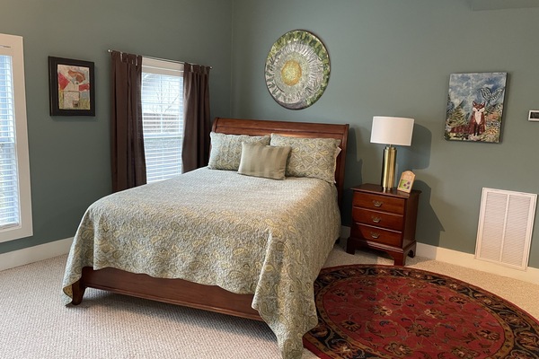 Queen bed all original art hung in loft.