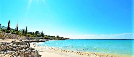 On the beach, sun-loungers