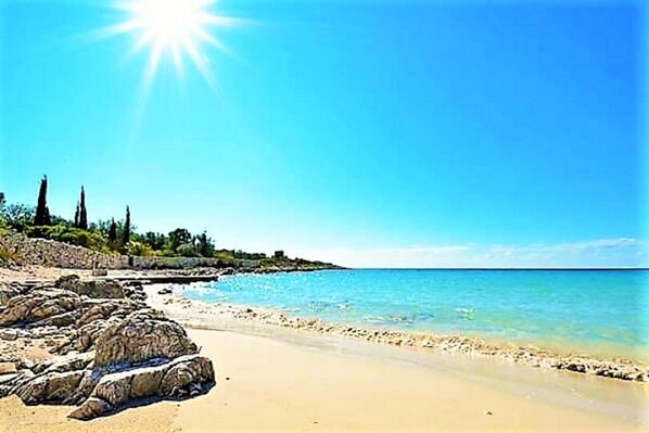 On the beach, sun loungers