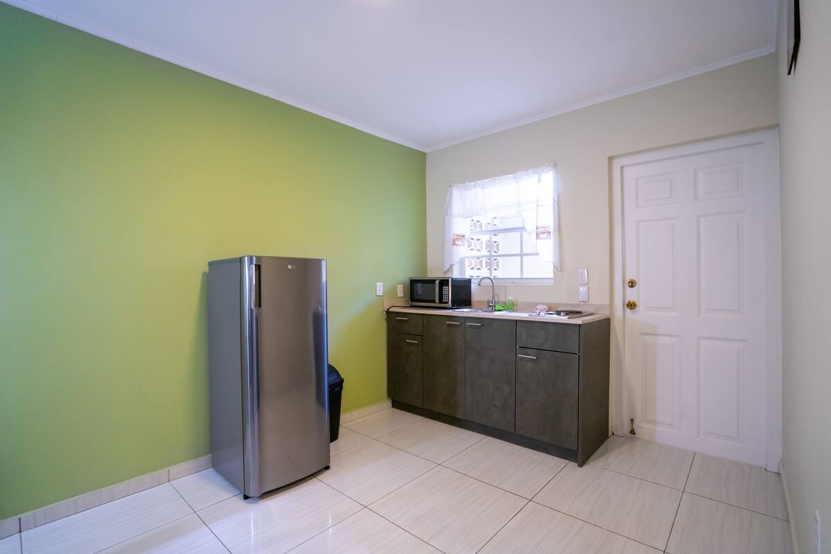 deluxe room, 2 bedrooms, non smoking, pool view | private kitchenette | fridge, microwave, stovetop, electric kettle