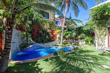 Private Topical Pool area with lush garden, hanging bed and with shady patio BBQ