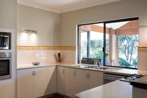 Coffee/tea maker, fridge, microwave, oven
