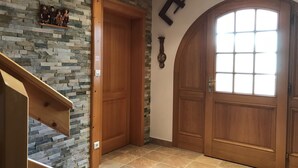 A wooden door with a window, a stone wall, and a staircase. - apartment/ flat - Soultzmatt (Soultzmatt)