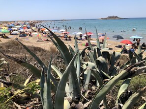 On the beach, sun loungers, beach towels
