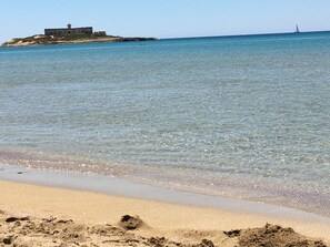 On the beach, sun loungers, beach towels