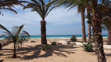 On the beach, sun loungers