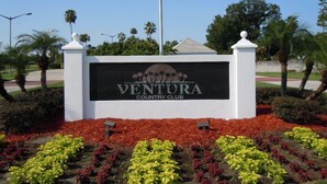 A sign for Ventura Country Club with a landscaped garden in front. -  Condo/apt. near Disney, Universal, 3 pools, WIFI,free Parking !  (Florida)