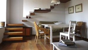 A modern interior with a staircase, seating area, and dining space. - Newly restored in 2012, rural environment, fully connected, very well connected (Isora)