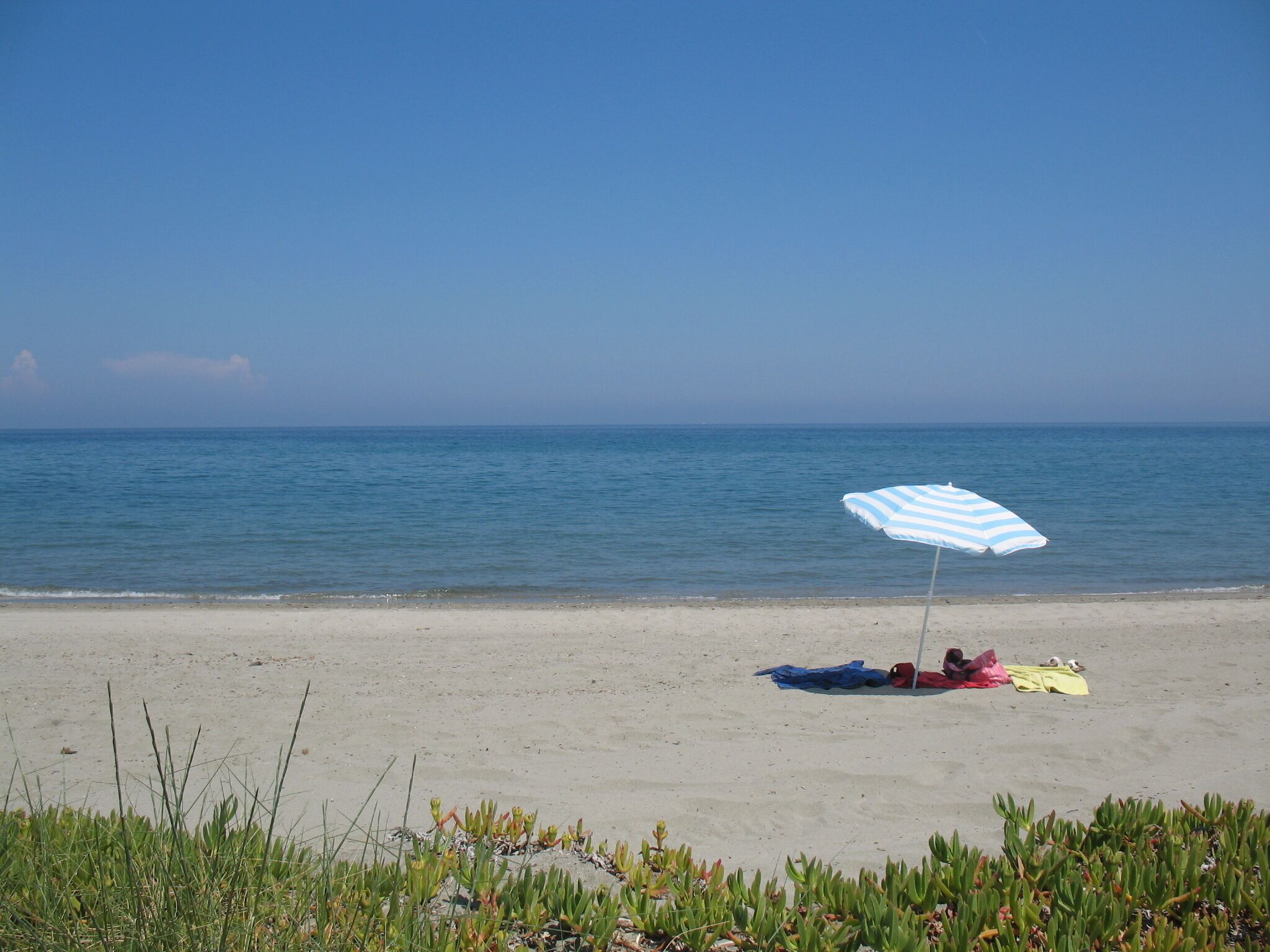 On the beach, sun-loungers, beach towels