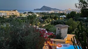 A pool area with a view of the sea and a mountain in the background. - The perfect holidays Villa - great views - Beach near by.  (Altea)