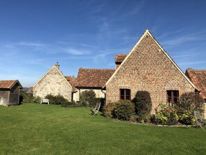 Experience the charm of a traditional farmhouse in a serene, picturesque setting.