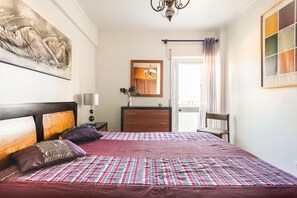 A bedroom with a large bed, a wooden headboard, a dresser, a chair, and a mirror on the wall. - Isabel Dream III, 6 km from Sintra train 400m (Rinchoa)
