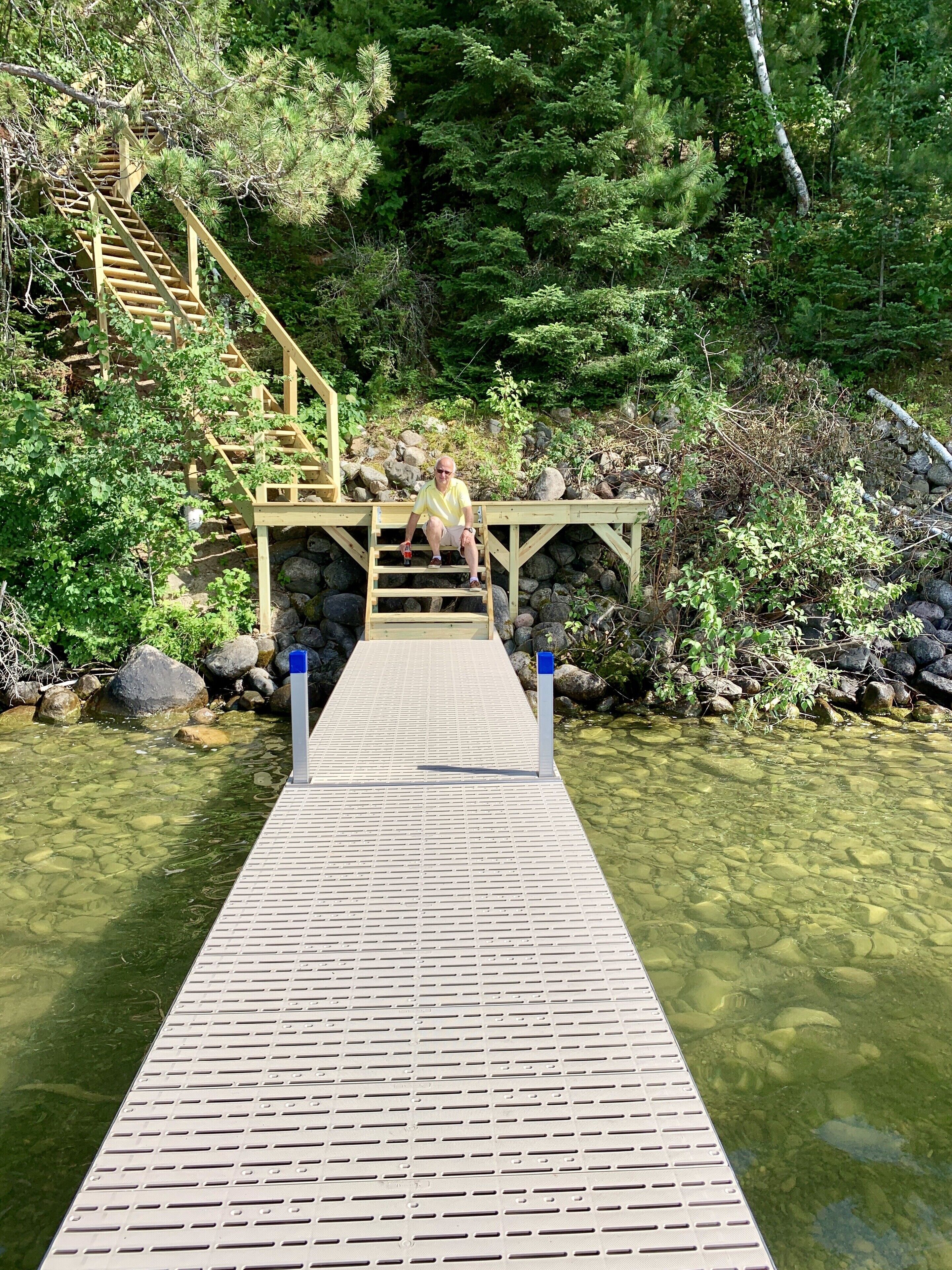 Lakeside steps and landing to the dock and its own boat lift… 