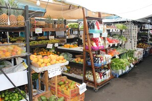 A market with various fruits and vegetables on display.