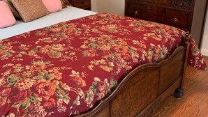 A bedroom with a wooden bed, a nightstand with a lamp, a dresser, and a mirror. - Peace, quiet & relaxation!  Family friendly home. (Sugar Grove)
