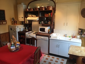 Coffee/tea maker, fridge, microwave, oven
