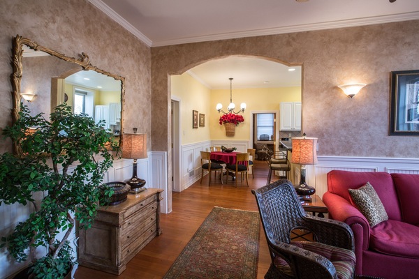 Huge, bright living space opens into dining area, kitchen and then bedroom.