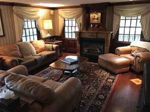 The living room features a gas fireplace operated seasonally.  - 4 bedroom all suite country home features a wrap around porch on an acre of land (Portsmouth)