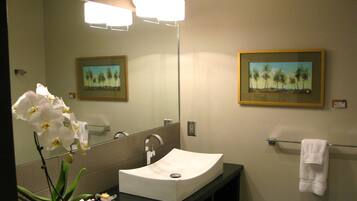 Shower, designer toiletries, hair dryer, towels