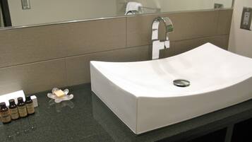 Shower, designer toiletries, hair dryer, towels