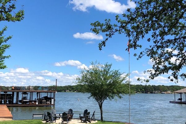 boat ramp, water view, dock to left and fire pit