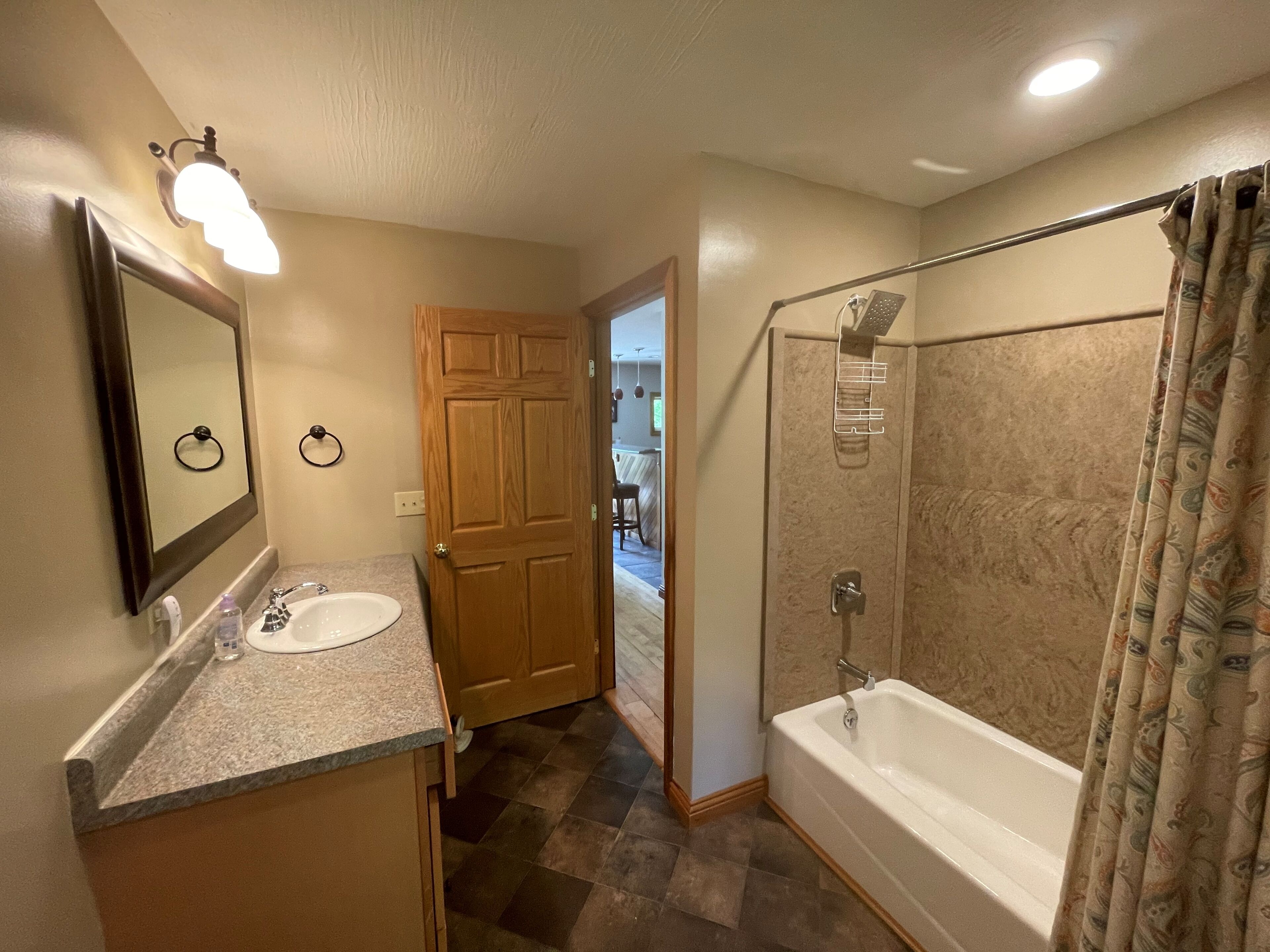 Combined shower/tub, hair dryer, towels, soap