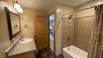 Combined shower/tub, hair dryer, towels, soap