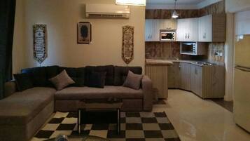 Apartment, 3 Bedrooms | Living area | 32-inch flat-screen TV with satellite channels, TV