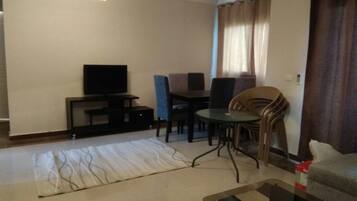 Apartment, 3 Bedrooms | Living room | 32-inch flat-screen TV with satellite channels, TV