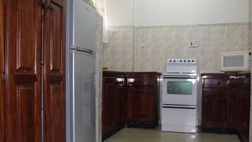 Apartment, 2 Bedrooms | Private kitchen | Full-sized fridge, microwave, oven, stovetop