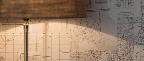 A map with a lamp casting a shadow over it.