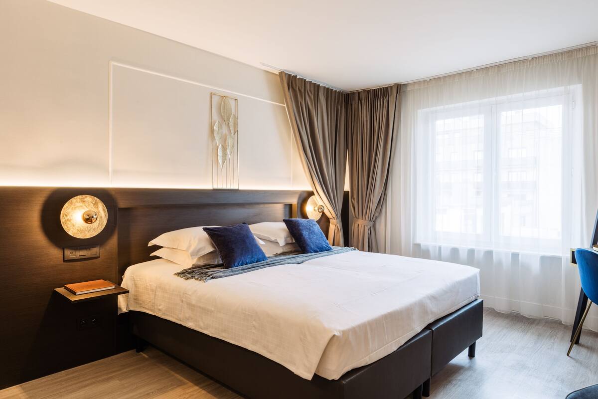 Habitación Confort con 2 camas individuales | Minibar, caja de seguridad en la habitación, cunas y wifi gratis