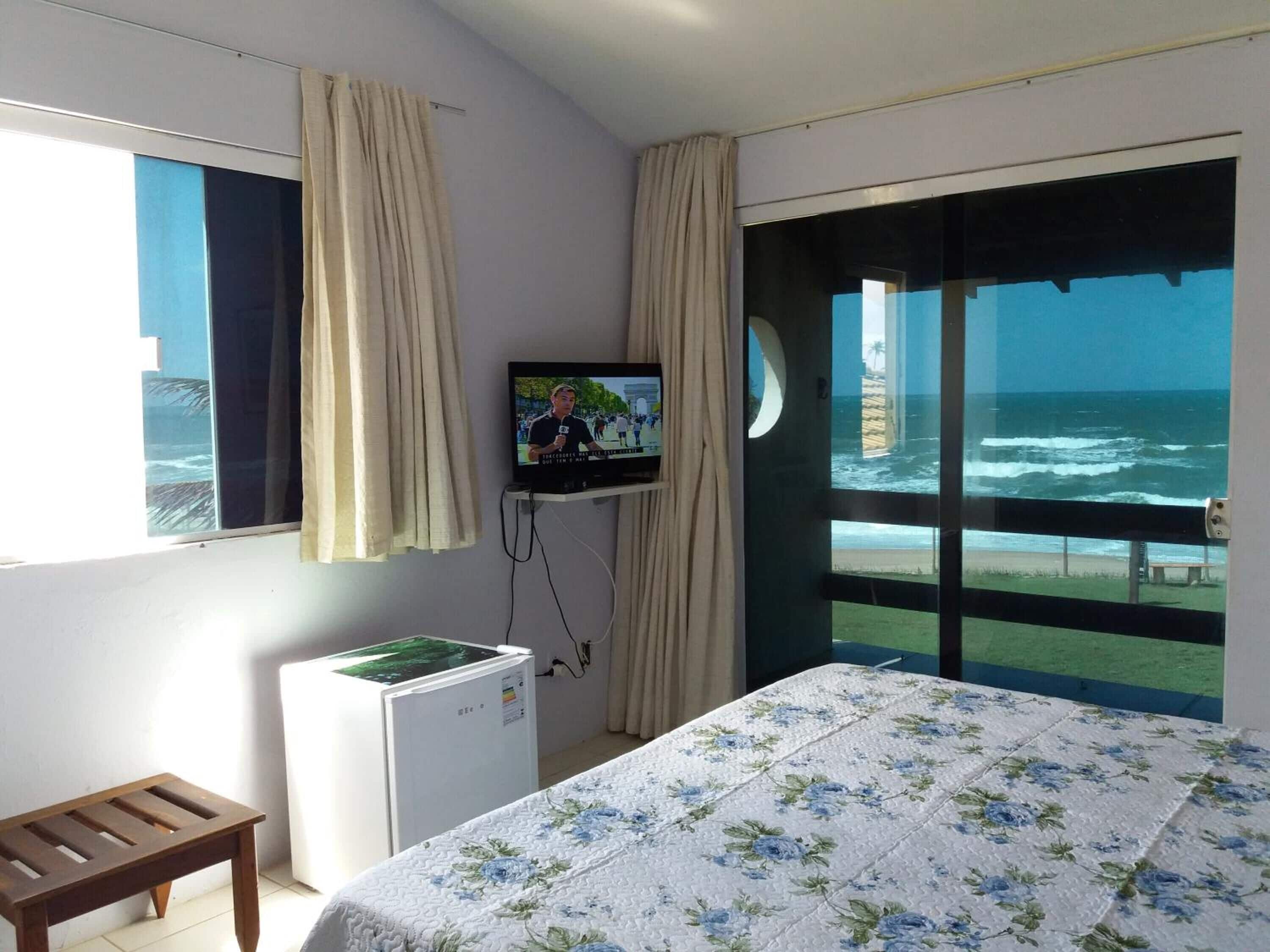 Suíte panorâmica (Vista Mar) | Frigobar, cortinas blackout, Wi-Fi de cortesia, roupa de cama