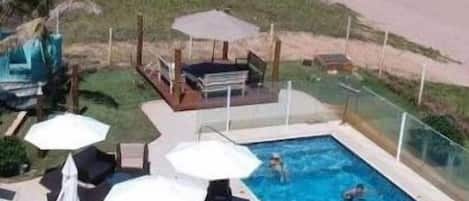 Outdoor pool, open 8:00 AM to 7:00 PM, pool loungers