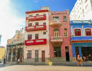 A multi-story building with balconies and a street in front. - Casa Mildred (Havana)