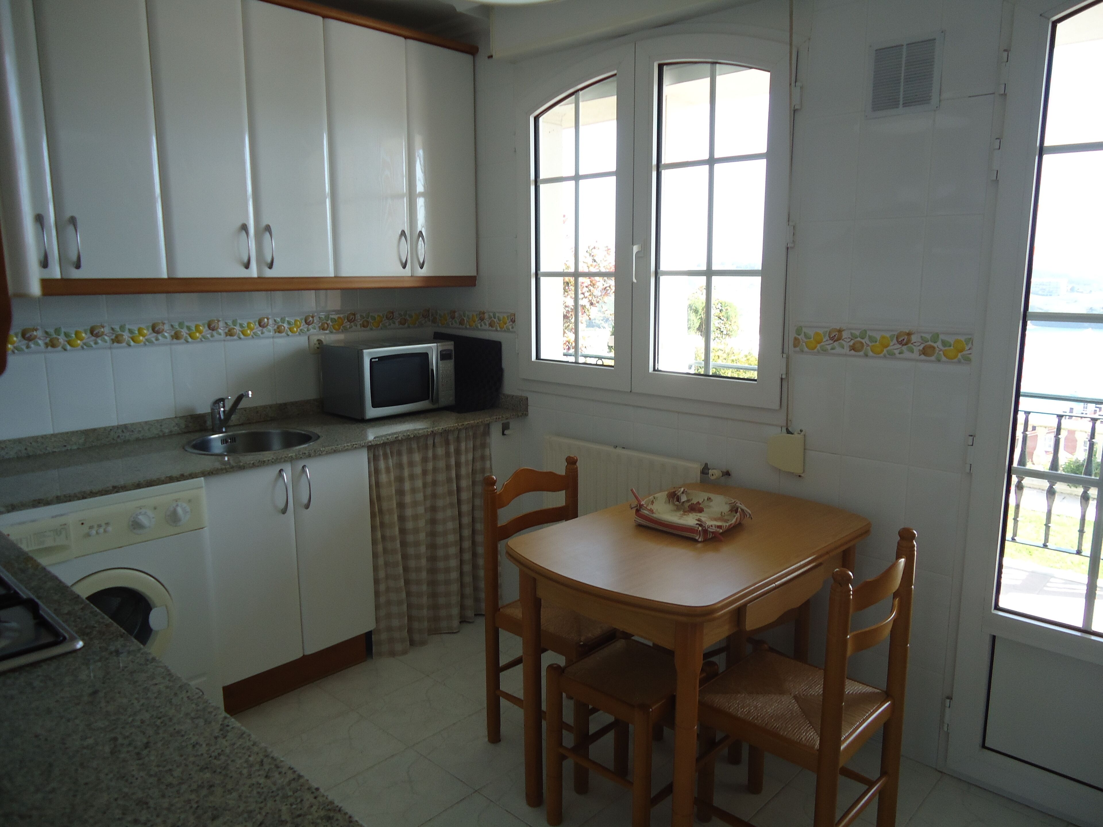 Semi-detached house with private garden and spectacular views over bay and beaches