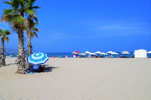 On the beach, sun loungers