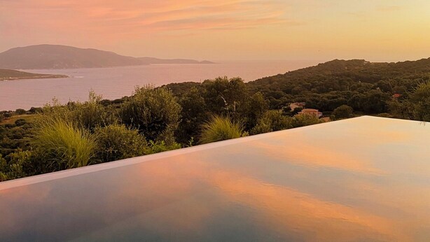 A panoramic view of a coastal landscape with a clear sky and distant mountains. - Villa Lourada architect house, swimming pool, spa 1.5 km from beautiful beaches  (Olmeto)