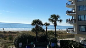 A beachfront building with multiple balconies overlooking the ocean. - Steps away from beach. Great for families. Townhouse with 3 bedrooms & 3 baths.  (North Myrtle Beach)