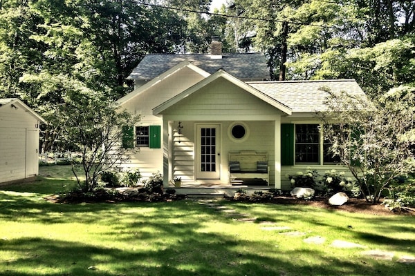 View of home from the backyard w/welcoming landscaping.