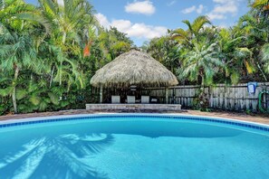 Outdoor pool, a heated pool - Fun Downtown Delray Home-Walk to Atlantic Ave.-Pool-Tiki hut-Bikes-WiFi-Near All (Delray Beach)