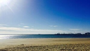 A beach with a clear sky and calm sea. - Charming 2br/2ba - steps 2 beach and all Ptown has to offer!  (Provincetown)