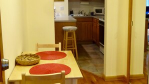 A dining area with a wooden table and chairs, a kitchen in the background, and a date stamp of 05 17 2019.