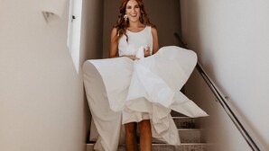 A staircase with a person in a white dress. - Beachside 880  beachfront luxury Apartment with Sunset views from the balcony. (Busselton)