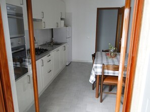 Fridge, oven, coffee/tea maker, cookware/dishes/utensils