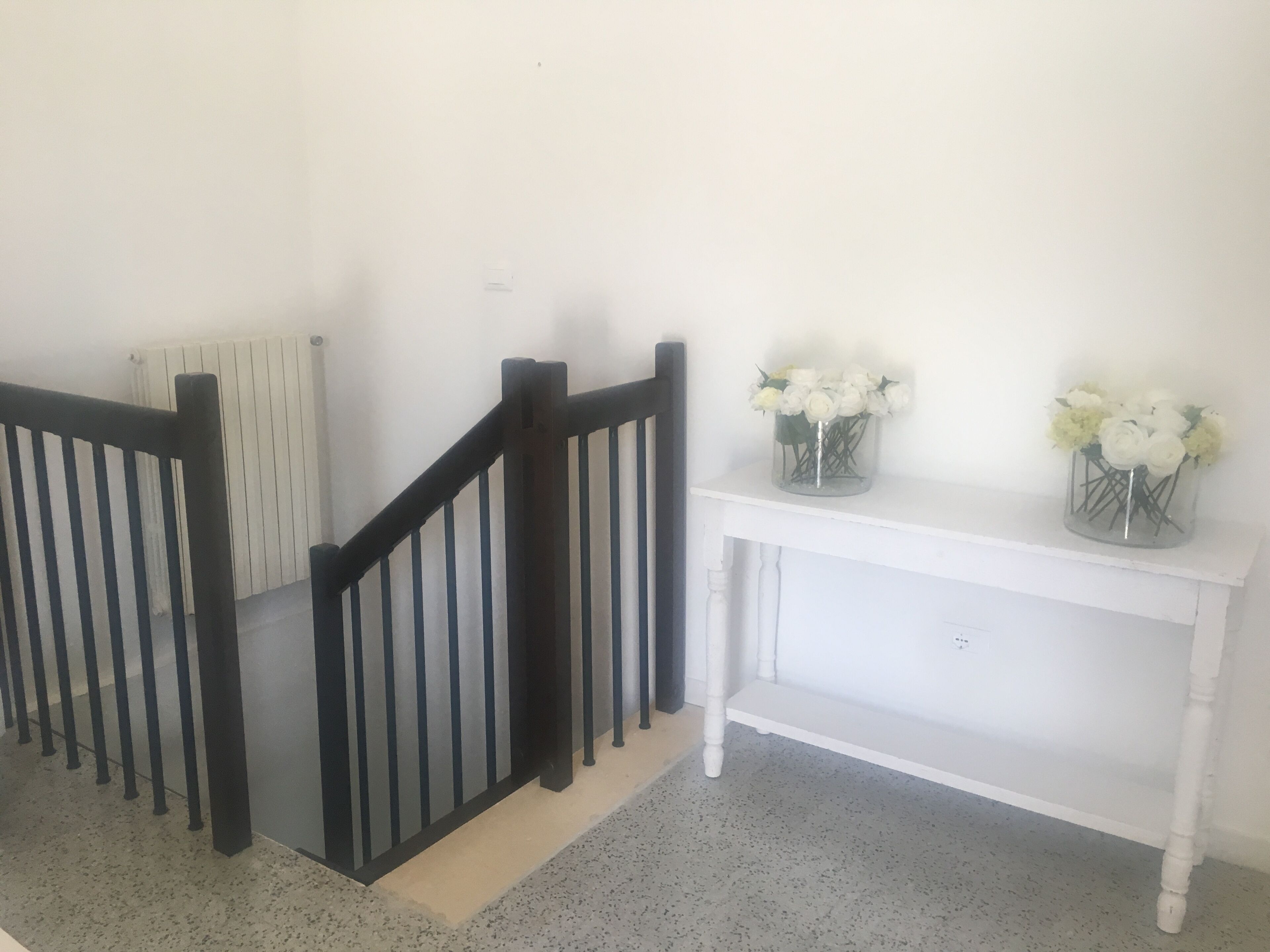 Stairs in room with sofa bed