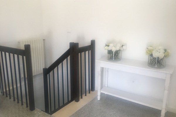 Stairs in room with sofa bed