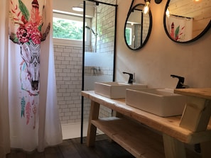 Shower, hair dryer, towels, toilet paper