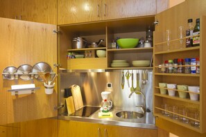 Fridge, microwave, stovetop, coffee/tea maker