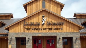 A wooden building with a sign that reads "Dupin Winery The Winery of the South". - Come spend a few days by  Barefoot Landing available July 10-14 (North Myrtle Beach)